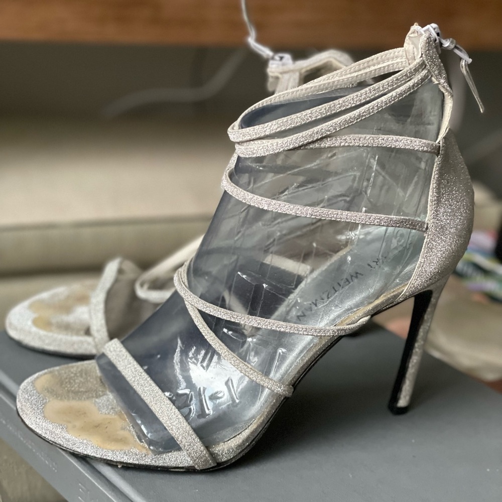 Stuart Weitzmans strappy silver heel sandals great for holiday wear